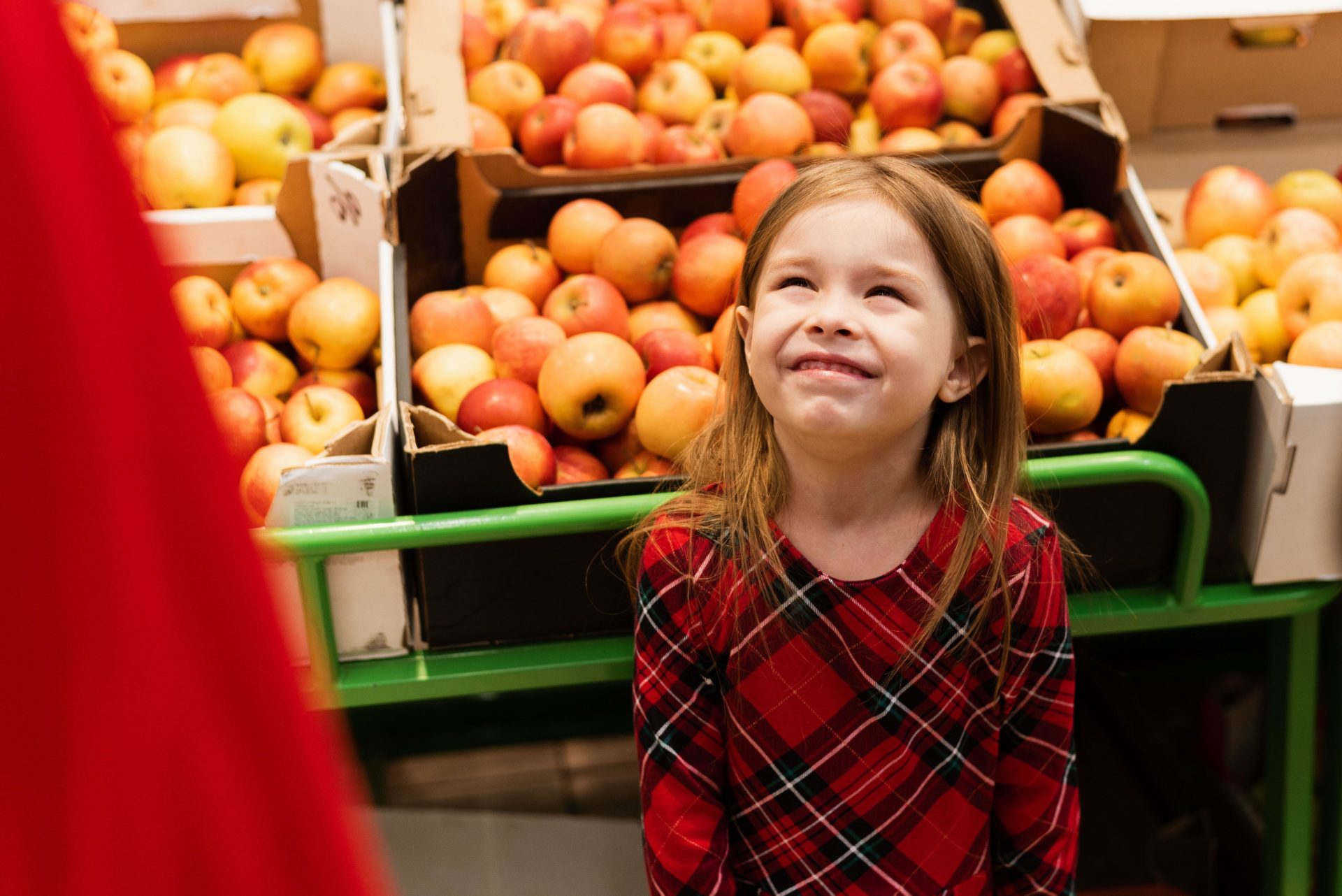 A little girl of about 5 threw a tantrum in a supermarket in front of her parents.